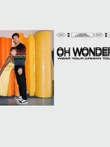 Na szarym tle zdjęcie dwójki artystów tworzących zespół.