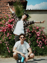 Baner promujący wydarzenie. Nazwa wydarzenia i zdjęcie artystów.