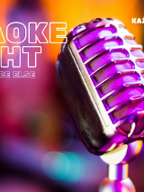 Zdjęcie mikrofonu na statywie. W tle rozmyte światła. Szczegóły dotyczące wydarzenia w treści artykułu.