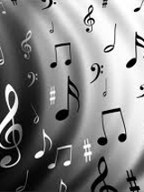 Na czarnym tle białe nuty.