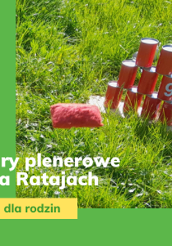 Puszki ustawione w formie piramidki stoją na trawniku, pod nimi napis o treści gry plenerowe na Ratajach, obok napis z datą 30 czerwca 2024.