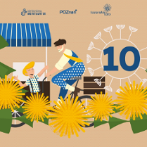 Grafika przedstawia uśmiechniętego chłopca przed straganem, obok niego siedzi na rowerze mężczyzna w berecie. Przed nimi wianek związany z mleczy.