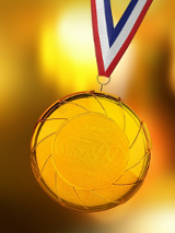 Zdjęcie, na złotym tle złoty medal.
