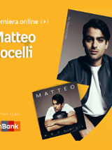 Plakat ze zdjęciem artysty i okładką płyty w prawej części. W części lewej imię i nazwisko na pomarańczowym tle.