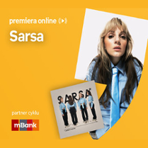 Plakat ze zdjęciem artystki i okładką płyty w prawej części. W części lewej pseudonim na pomarańczowym tle.