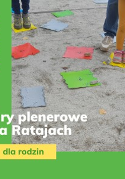 dziecięce nogi stojące na kolorowych kwadratach na ziemi