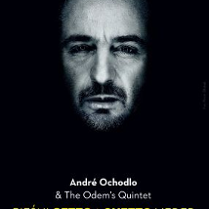 Plakat: zdjęcie twarzy mężczyzny na czarnym tle.