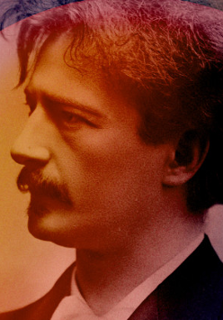 na pomarańczowo żółtym tle widoczny profil Ignacego Jana Paderewskiego