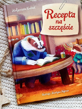 Zdjęcie przedstawia okładkę książki. Znajduje się na niej borsuk stojący z kontuarem, przyodziany w okulary i płaszcz.