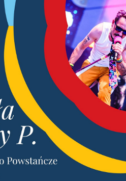 Plakat promujący koncert na miasteczkowej scenie. W prawym, górnym narożniku zdjęcie koncertowej sceny z wokalistą. Granatowe tło, obok czerwone, żółte i niebieskie wstęgi.