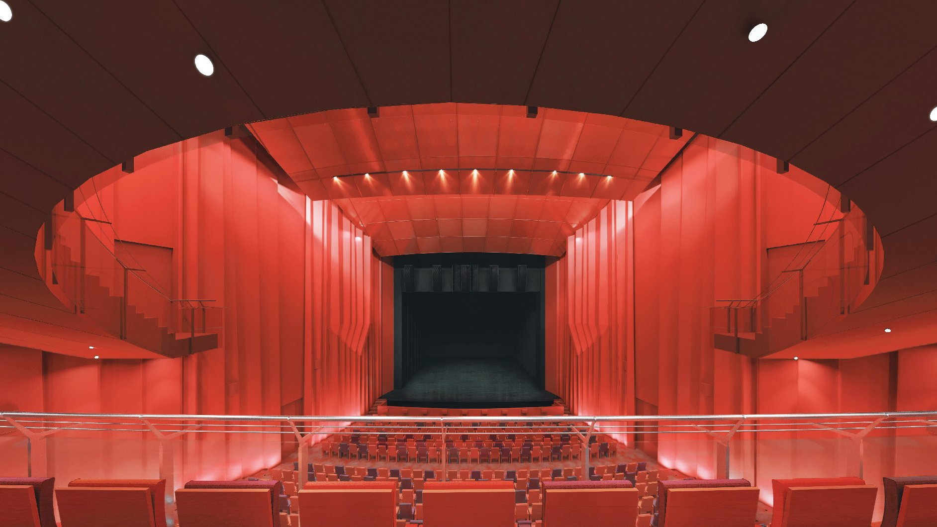 Wizualizacja sali głównej przyszłego Teatru Muzycznego, część dla publiczności i scena utrzymana w kolorach czerwonych, widać scenę, miejsca parterowe i balkon dla publiczności