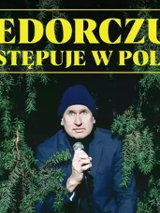 Plakat występu Wojtka Fiedorczuka, ze zdjęciem artysty.
