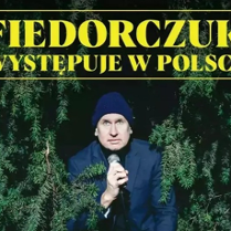 Plakat występu Wojtka Fiedorczuka, ze zdjęciem artysty.