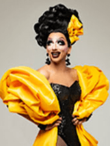 Zdjęcie artystki w żółto-czarnej sukni.