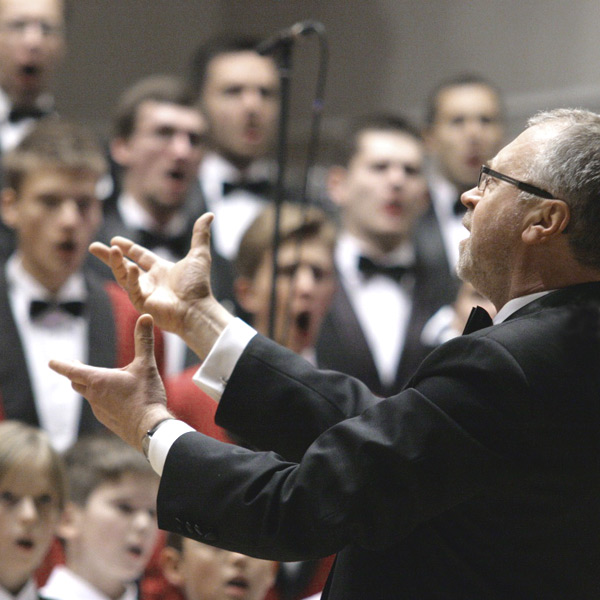 Photo of the conductor conducting a choir