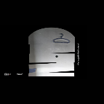 Clothes hanger on a gray wall on a black background