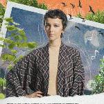 Photo of the vocalist, Brodka. The picture presents young woman looking at he camera on a blue-green-orange background.