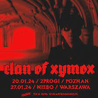 Concert poster in black and red colours: photo of a man in a dark corridor and information about the event.