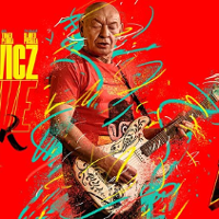 Concert poster - colourful photo of the artist.