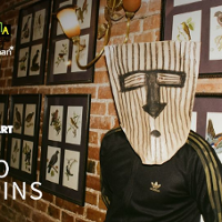 Photo of a person with a mask on his face.