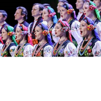 Photo of the women and men in two rows in traditional folk costumes.