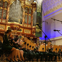 Picture of the Orchestra performing on stage of AMU Auditorium
