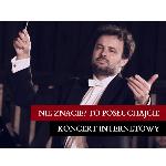 A picture of a conductor holding a baton in his hand