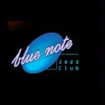 Blue circle and a name of a club on a black background