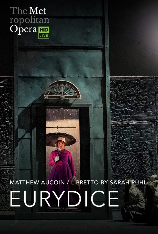 The poster shows a woman standing inside the hotel's elevator. The woman has an open umbrella because it is raining inside the elevator