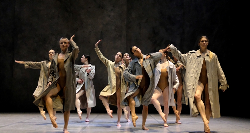 Photo from Fabula Rasa performance - dancers in coats performing on stage
