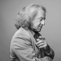 Black and white picture of the conductor Marek Pijarowski - a thoughtful man in a profile