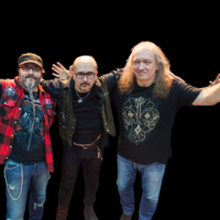 Photo of three men - members of the band