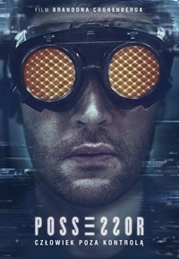Dark photo of a man's face in yellow goggles