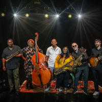Photo of the band - six people holding their musical instruments