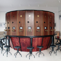 Wooden round device with glasses for viewing stereo photos.