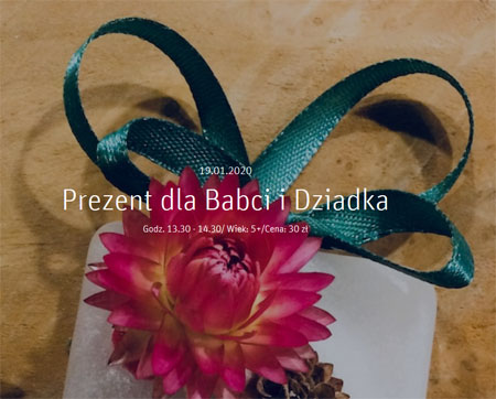 Baner wydarzenia:Kwiat i wstążka na prezencie.