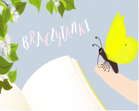 Otwarta książka i motyl.Po lewej i u góry zielone listki.