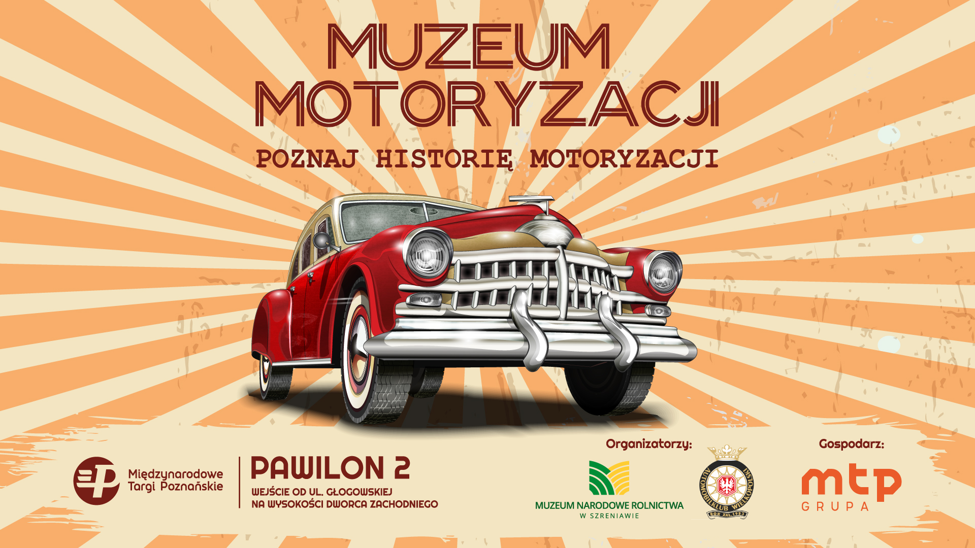 Na pomarańczowym tle zabytkowe auto.