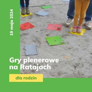 dziecięce nogi stojące na kolorowych kwadratach na ziemi