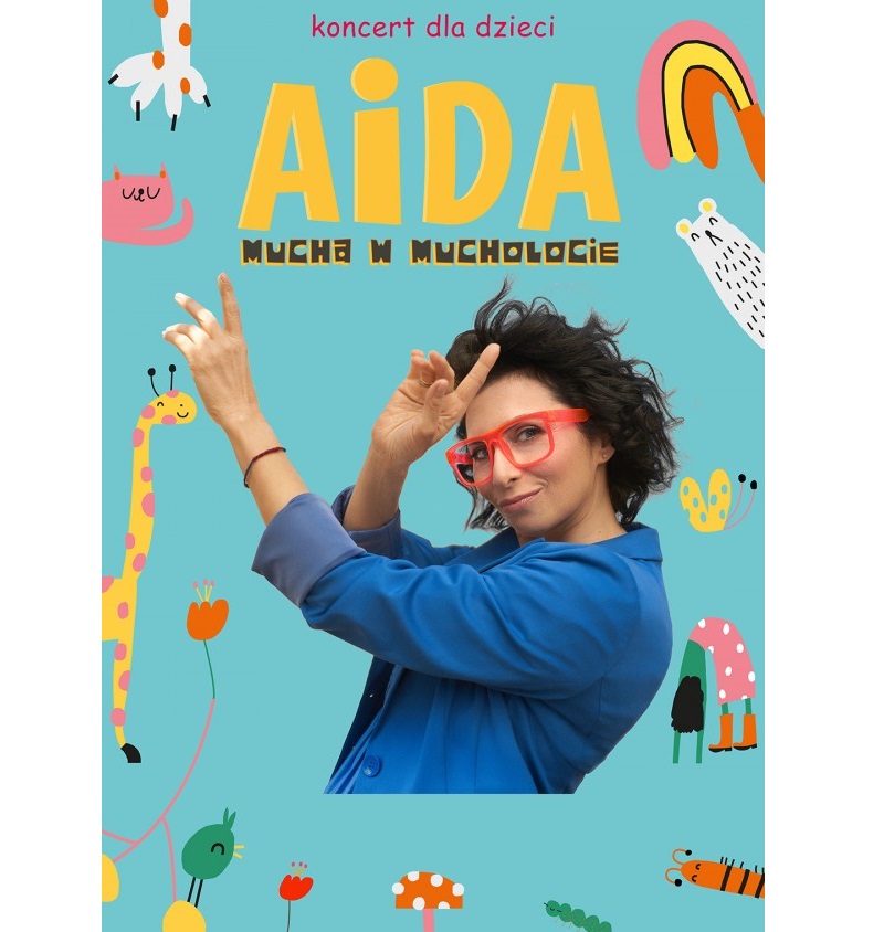 Plakat dotyczący wydarzenia. Na nim piosenkarka w niebieskiej koszuli i dużych czerwonych okularach oraz tytuł koncertu.