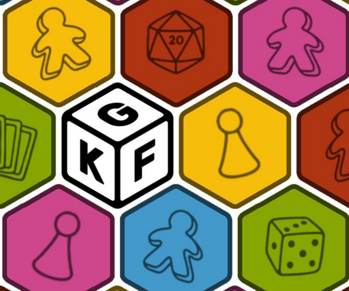 Kolorowe sześciokąty, stykają się ze sobą tworząc obraz, pośrodku jeden biały z literami K, G i F.