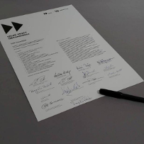 Zapisana karta papierowa z nadtytułem Szlak Pracy Organicznej, poniżej treść listu intencyjnego oraz podpisy 14 osób