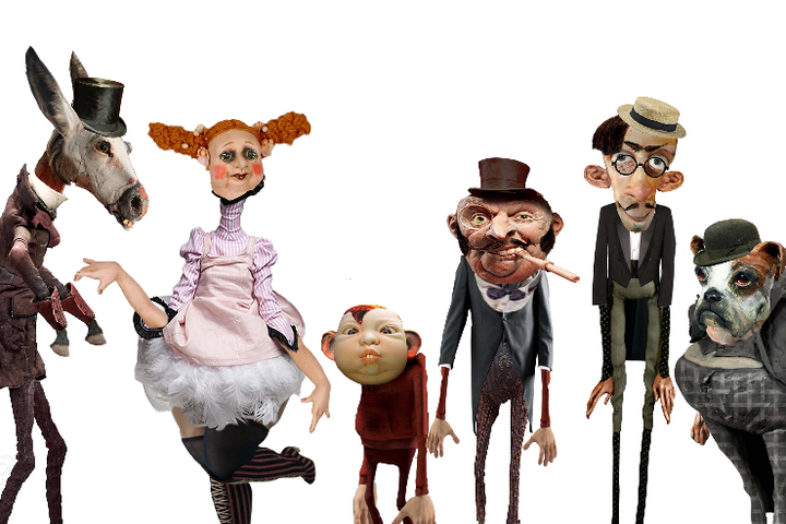 Zdjęcie kilku lalek o karykaturalnych rysach twarzy.